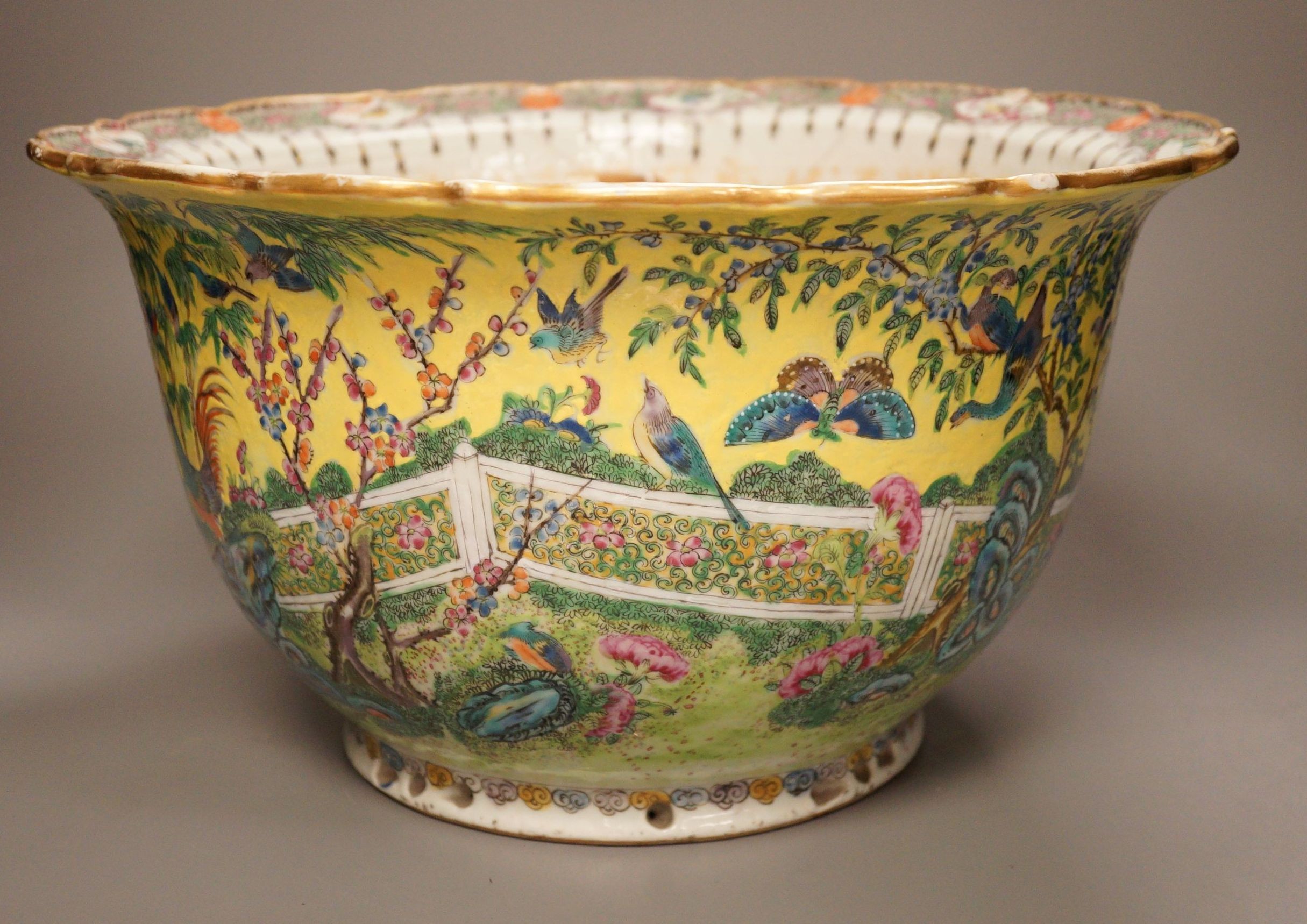 An early 20th century Chinese famille rose yellow ground jardiniere, a.f, 37cm